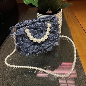 Woman faux pearls purse